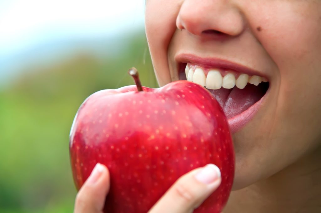 Biting an apple